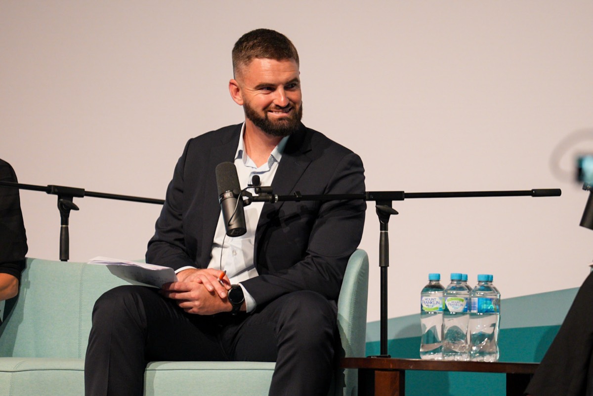 Dane Mitchell on stage at the Ageing Australia QLD State Conference 2026